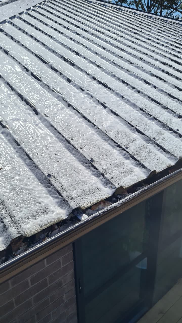 Roof coated in foam during a Spray Away moss and mould treatment